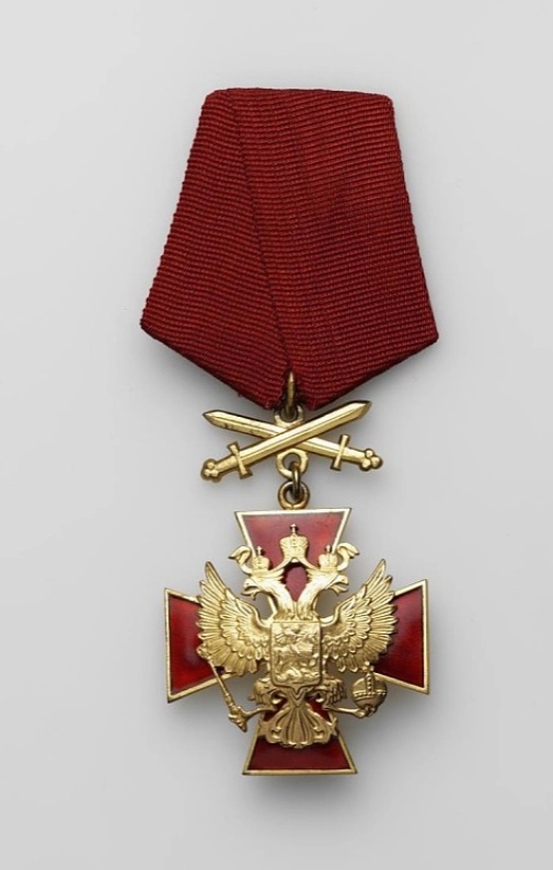 Знак ордена «За заслуги перед Отечеством» IV степени с мечами на колодке